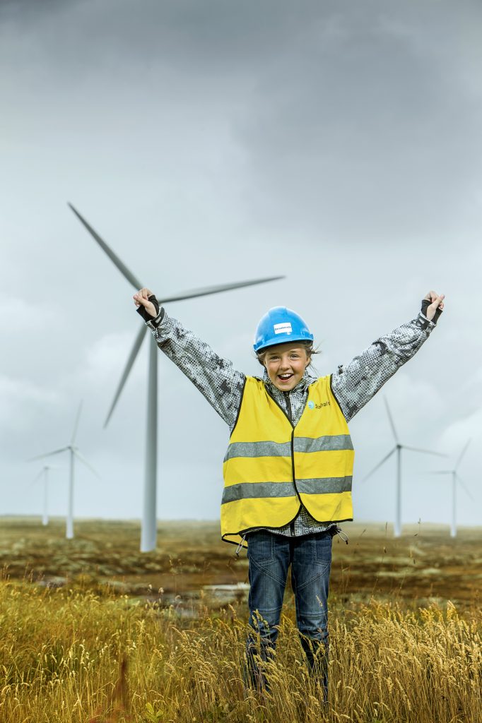 Young girl visiting a wind farm